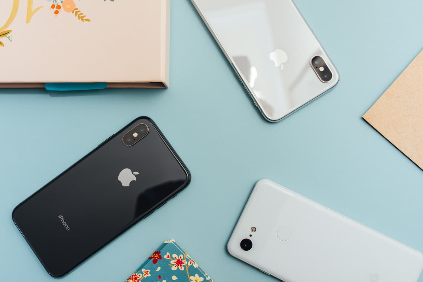 Several smartphones laid out on a table